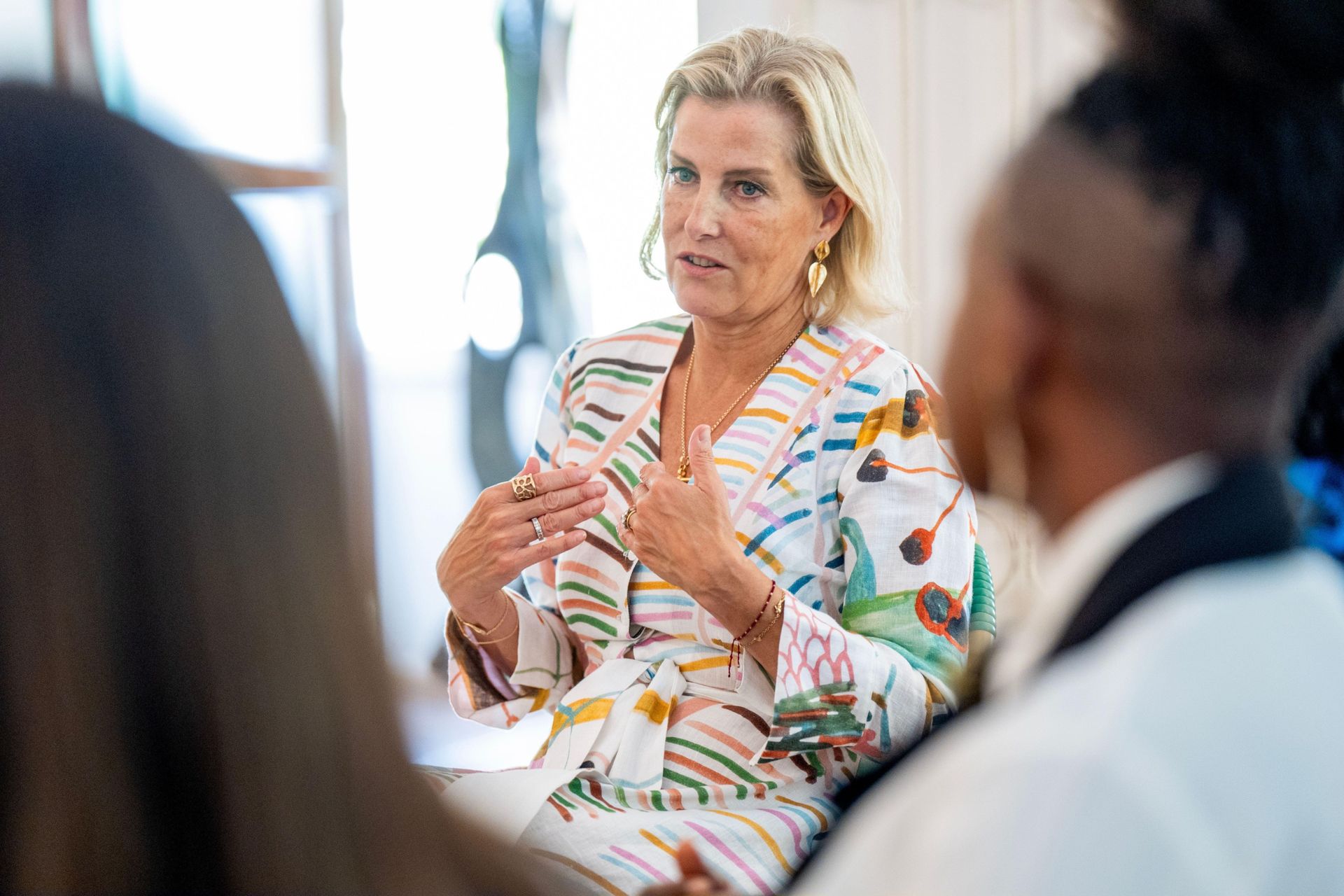 Duchess Sophie wearing a white dress with a rainbow pattern