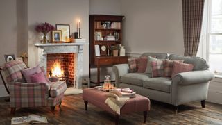 open fireplace in living room with grey sofas
