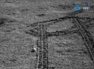 Yutu-2 looks back over tracks it made in the lunar soil.