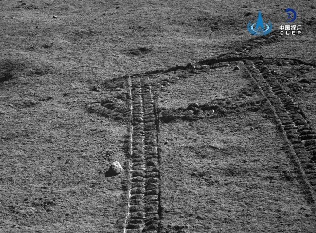 Yutu-2 looks back over tracks it made in the lunar soil.
