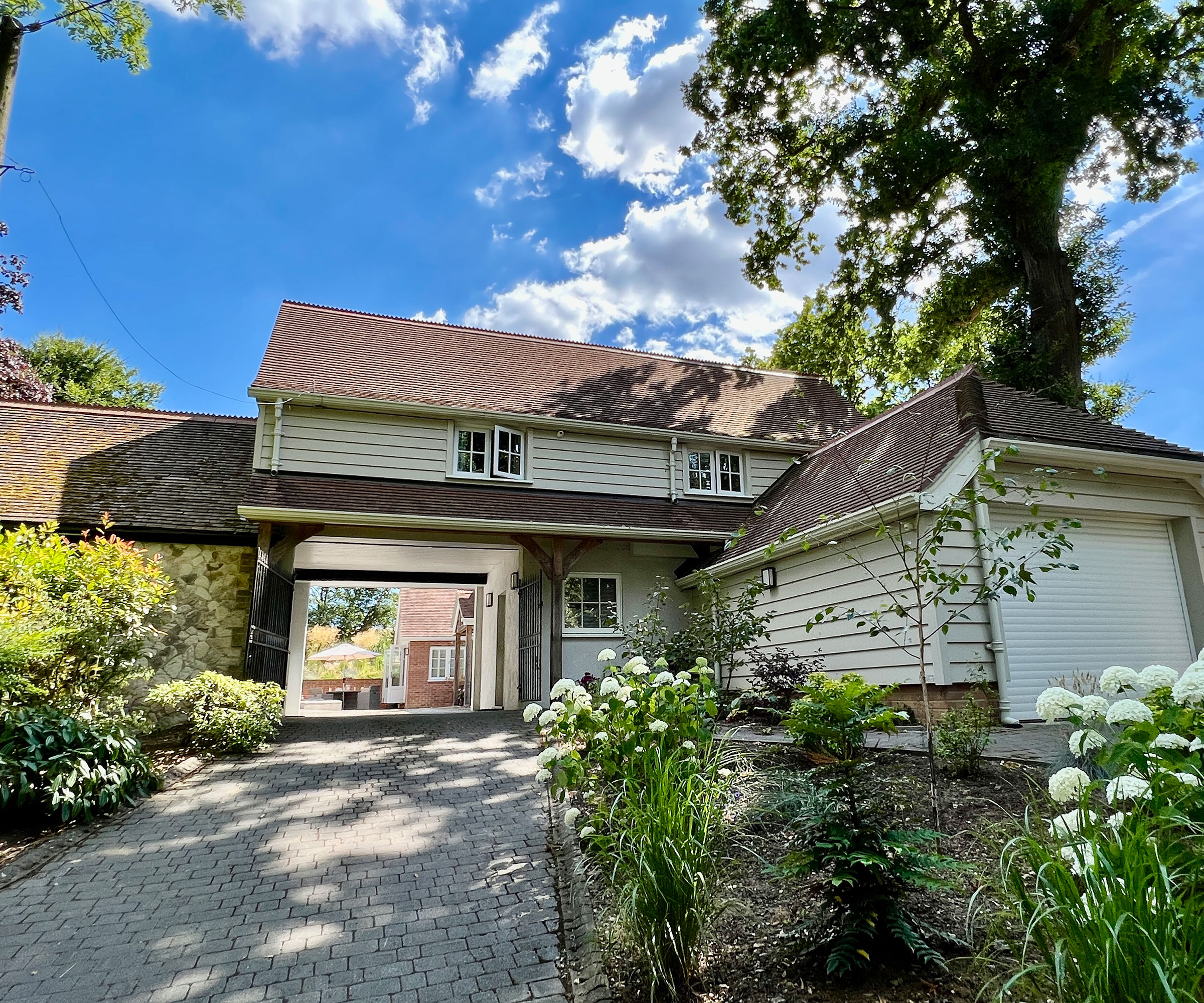coach house makeover with painted weatherboarding