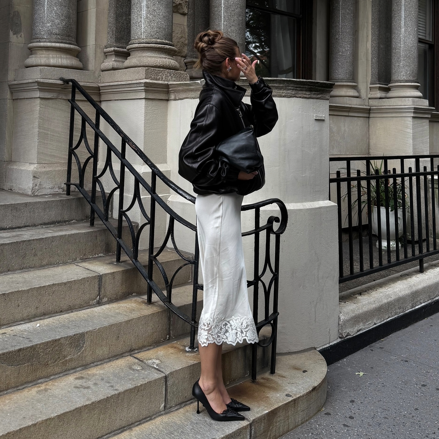 Sara Walker in a leather Brandon Maxwell jacket and lace skirt