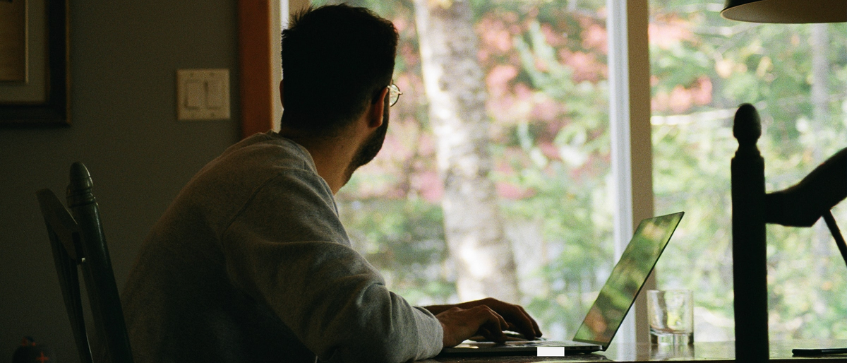 Man in home office on laptop