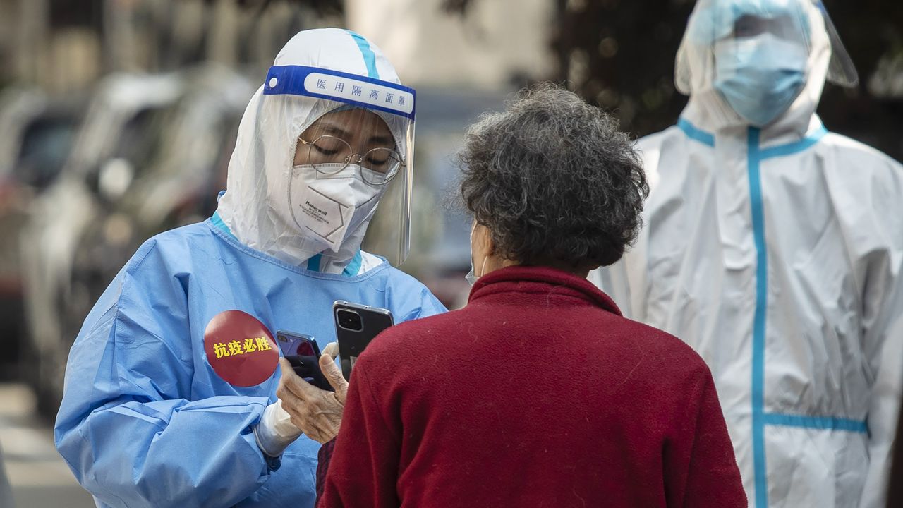 Healthcare workers conducting Covid-19 tests in Shanghai, China