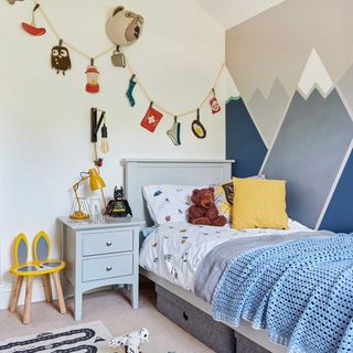 Blue kids room with mountain paint effect