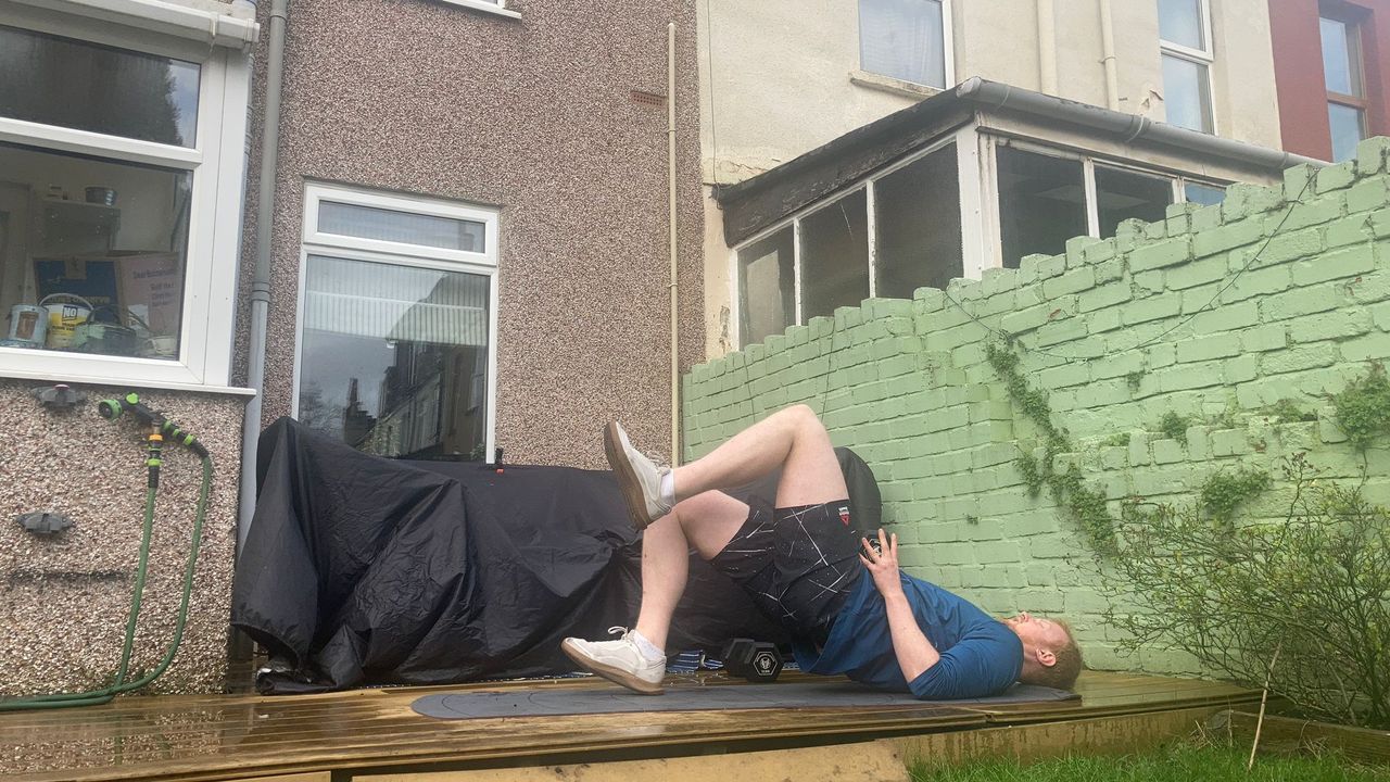 Fit&amp;Well fitness writer Harry Bullmore demonstrating a glute bridge march