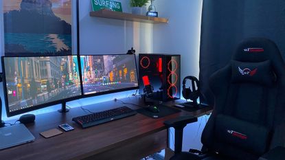 Best gaming monitors: Gaming monitor at desk with gaming chair and headphones 