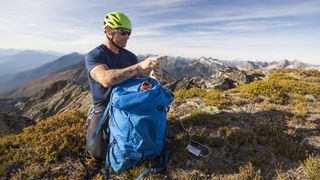 rechargeable or disposable batteries: hiker using tech