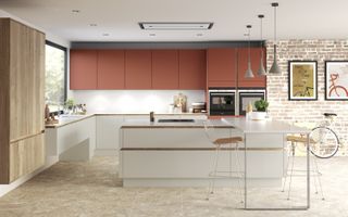 handleless kitchen with coloured cabinets and copper finishes