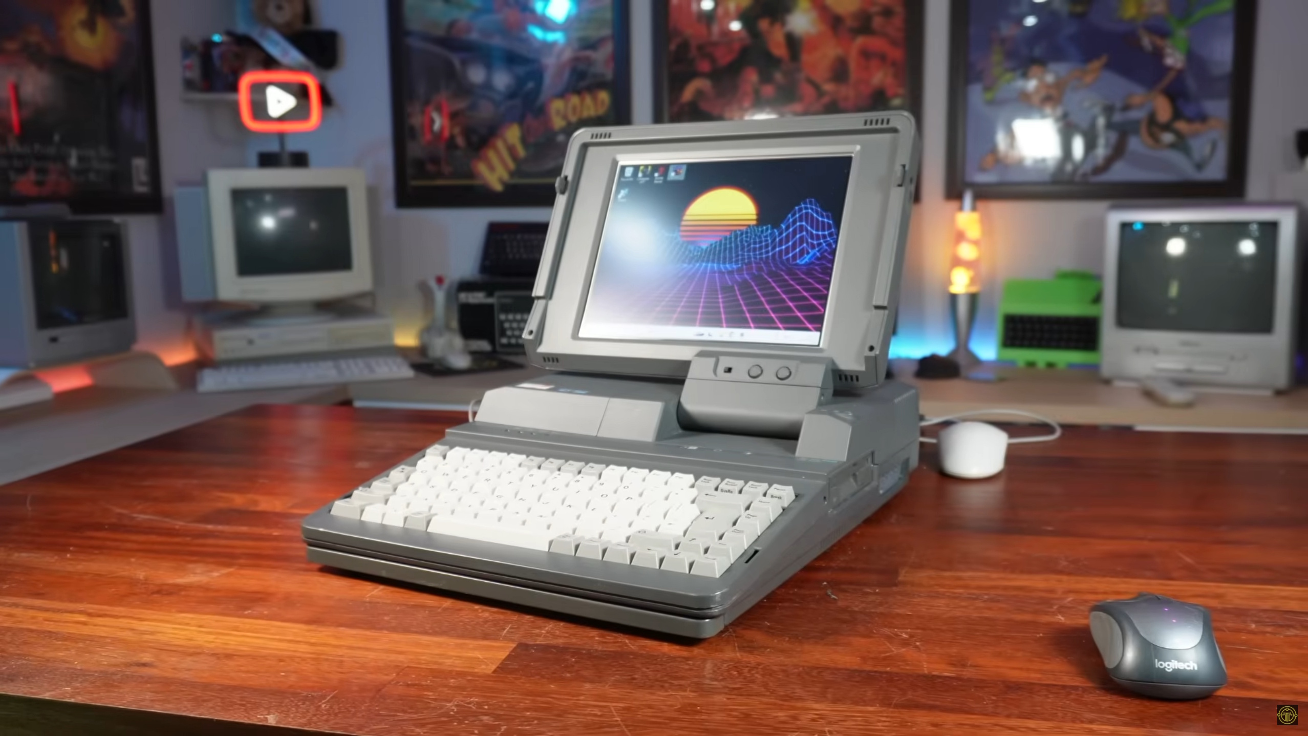 An Amstrad-ALT286 retro PC with a Minisforum UM890 Pro mini PC inside, on a desk with a retro mouse