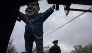 Watchmen a gigantic Nixon statue about to be brought down