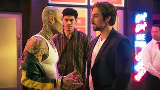 Lincoln Younes as John Ibrahim squares up to a tattooed man in a scene from Last King of the Cross