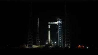A SpaceX Falcon 9 rocket with the company&rsquo;s Dragon spacecraft on top stands vertical on the launch pad at Space Launch Complex 40 at Cape Canaveral Space Force Station in Florida on Friday, Feb. 13, 2026, ahead of NASA&rsquo;s SpaceX Crew-12 launch.