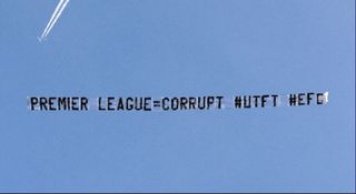 Everton fans fly a banner over the Etihad during the Manchester City-Liverpool game to protest against their recent points deduction.