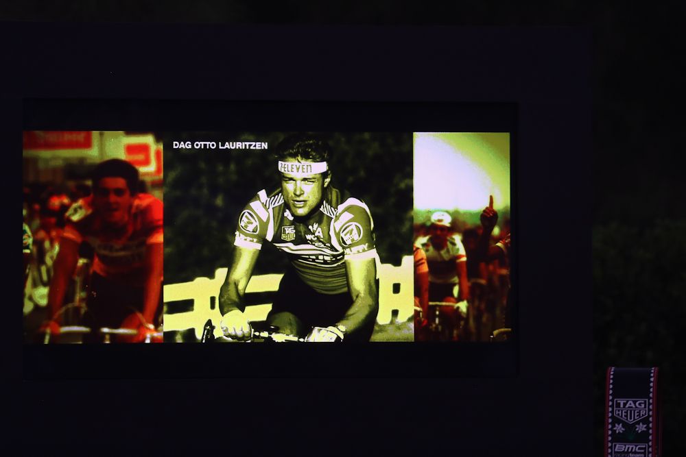 Guests watch a vidoe screen during a press conference to announce Tag Heuer as a new sponsor of the BMC Cycling team