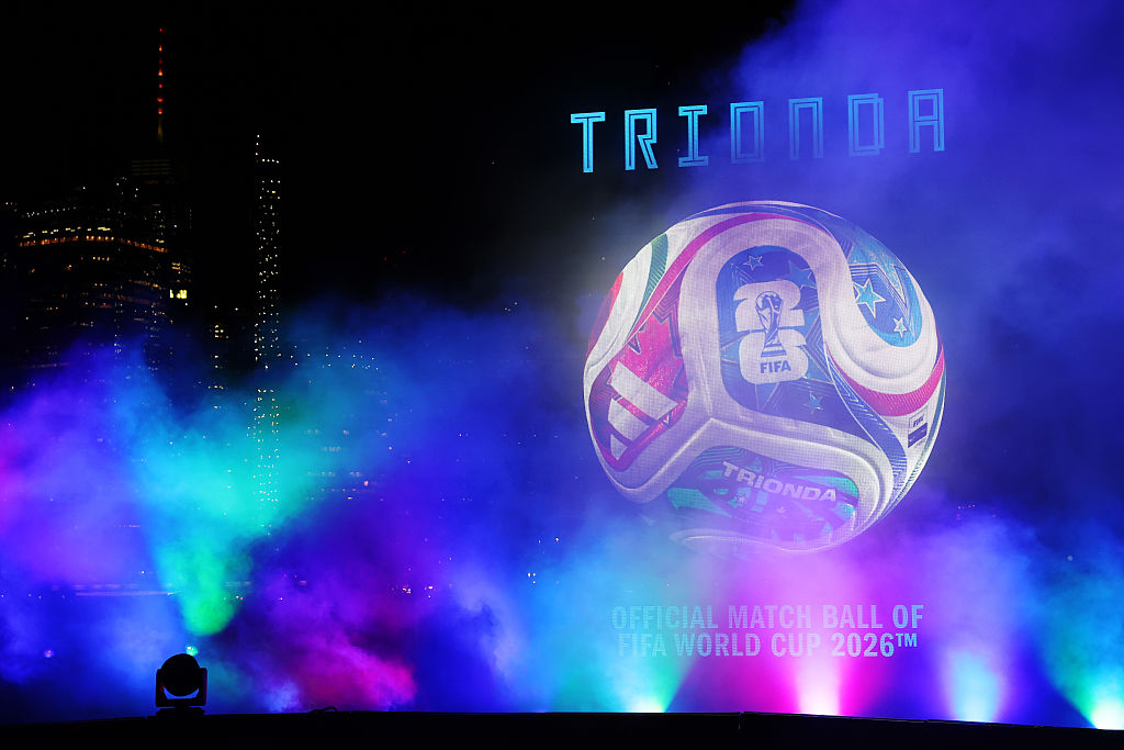 A huge projection of the adidas Trionda against the New York City skyline