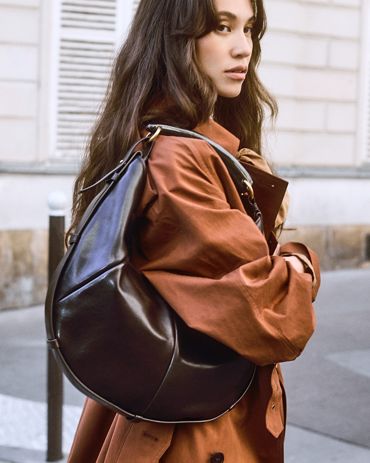 Kiko Mizuhara wearing the Saint Laurent Mombasa handbag. Courtesy of Saint Laurent.