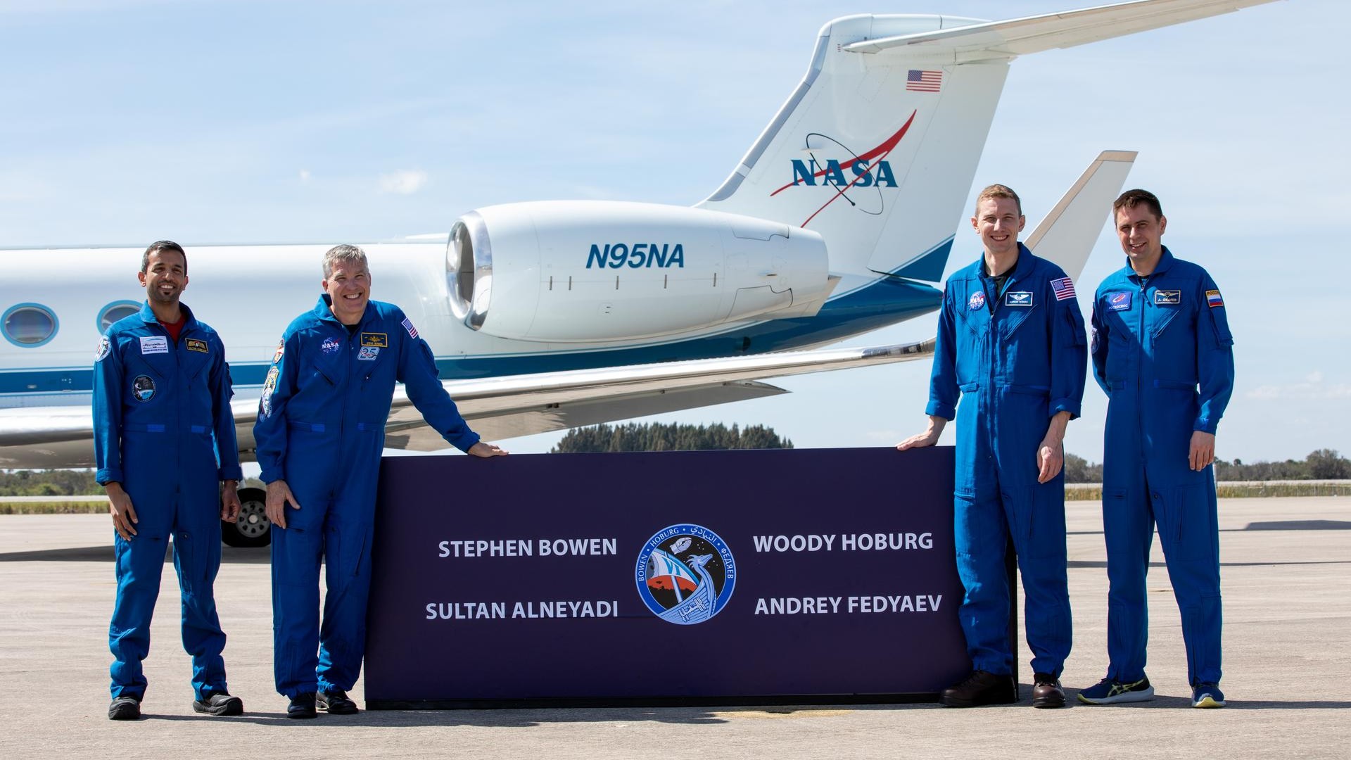 The crewmembers of SpaceX's Crew-6 mission pose after arriving on the tarmac at Kennedy Space Center.