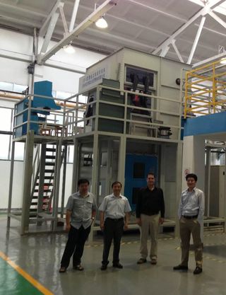 At a height of about two stories high, this may be the world's largest metal 3D printer. At Northwestern Polytechnical University (NPU) in Xi'an, professor Huang Weidong (second from left) has successfully printed precisely shaped titanium airplane parts more than two meters long. Also pictured is Hod Lipson (second from right), and Shuguang Li (fourth from left) 3D printing expert and creator of one of China's first public 3D-printing hacker spaces.