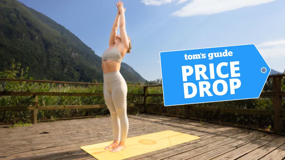 Woman practicing yoga outdoors on Liforme yoga mat with price drop deal badge top right corner