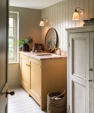 yellow and green laundry room with tongue and groove