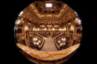 This photograph taken by a fish-eye lens shows the grand staircase of the Palais Garnier in Paris on December 9, 2024. Inaugurated on January 5, 1875 and classified as a historic monument, the Palais Garnier will celebrate its 150th anniversary, it houses part of the Paris Opera which presents ballets and lyrical works on stage.