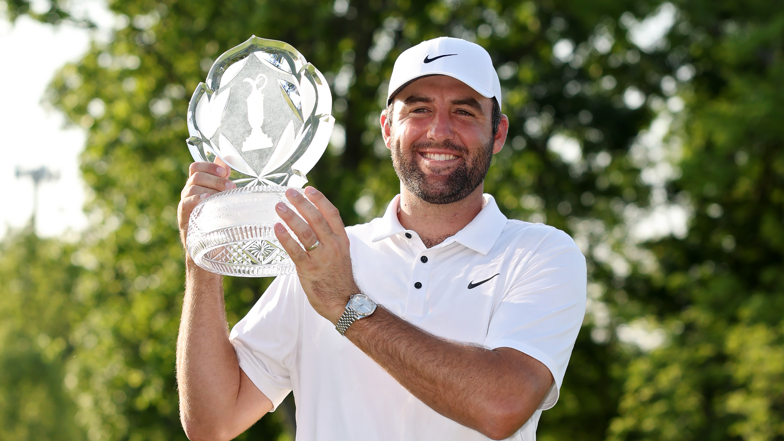 Scottie Scheffler with the trophy after winning the Memorial Tournament