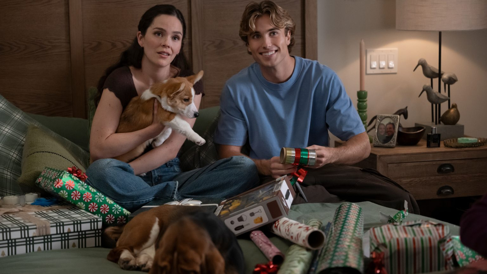 A couple unboxing presents in a scene from A Dog's Perfect Christmas