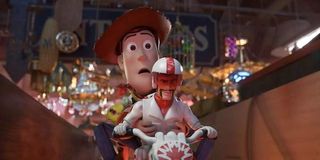Keanu reeves as Duke Caboom on a motorcycle with Tom Hanks' Woody in Toy Story 4