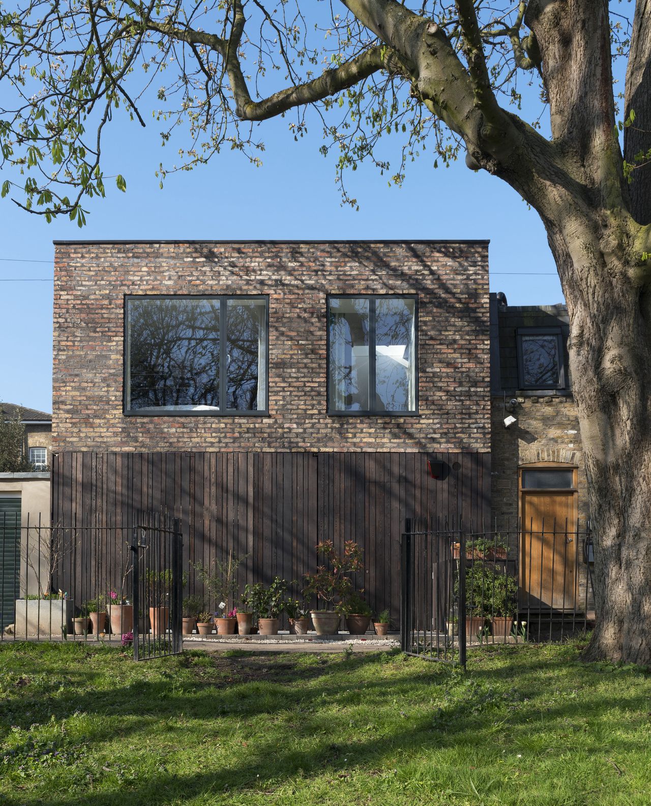 larch clad doors on brick self build
