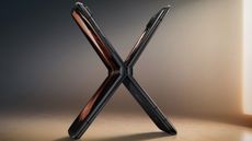 Two Motorola Razr 2022 smartphones open and back to back, forming an X shape