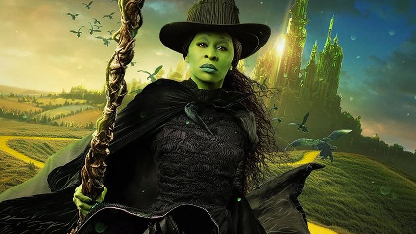 Elphaba sits on broom