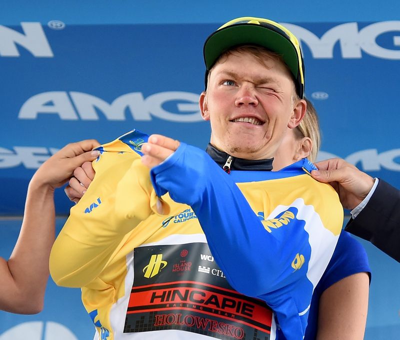 Toms Skujins pulls on the leaders jersey for another day