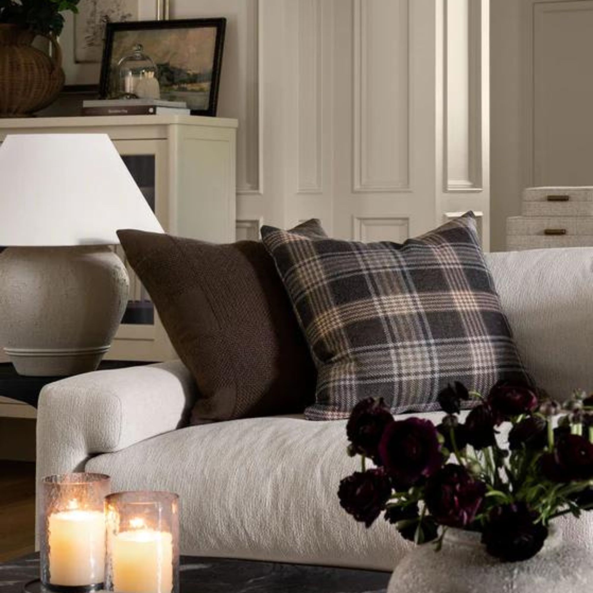 Two throw pillows on a white sofa