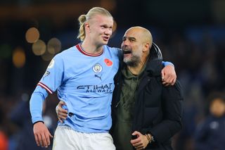 Erling Haaland and Pep Guardiola celebrate after Manchester City's win over Fulham in November 2022.