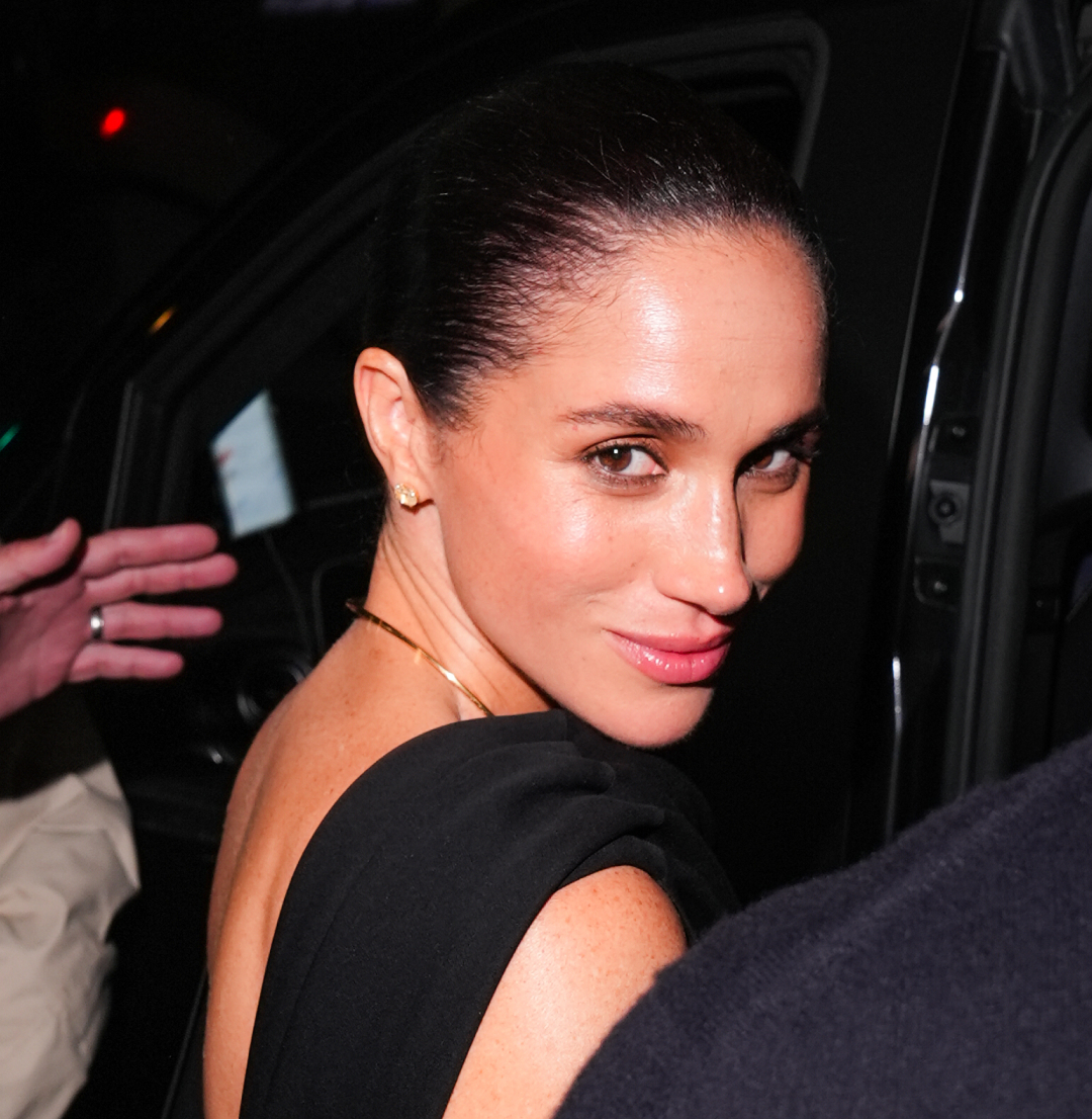 Meghan Markle wearing a black dress