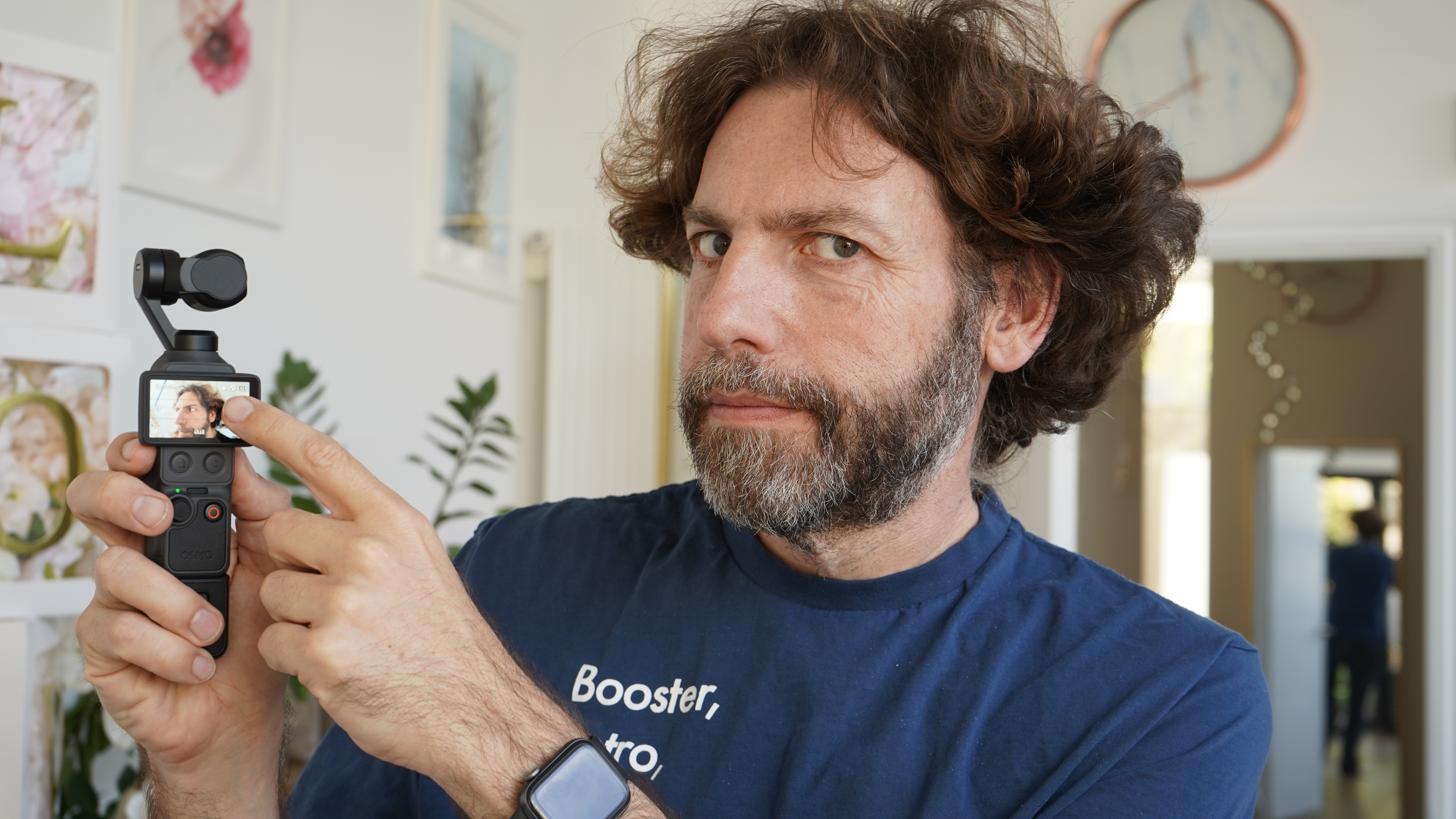 Adam pointing at the screen on the DJI Osmo Pocket 4