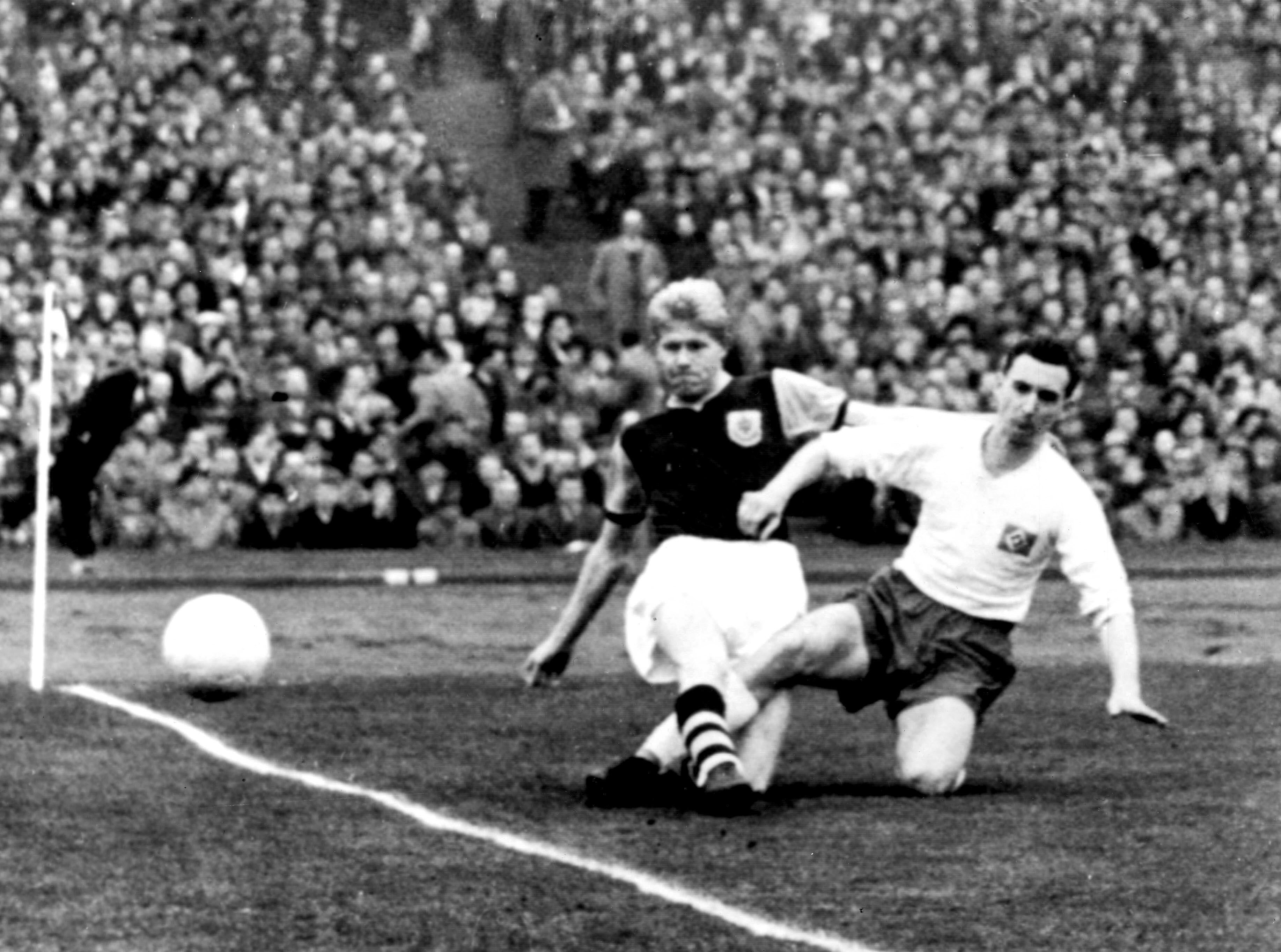 Burnley's Ray Pointer challenges Hamburg's Jochenfritz Meinke during the quarter-finals of the 1960/61 European Cup