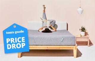 A person lying on the Siena Memory Foam Mattress in a bedroom, a Tom's Guide price drop deals graphic (left)