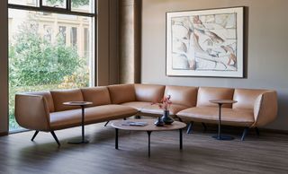 corner leather sofa in front of large picture window