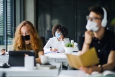People wearing masks indoors.