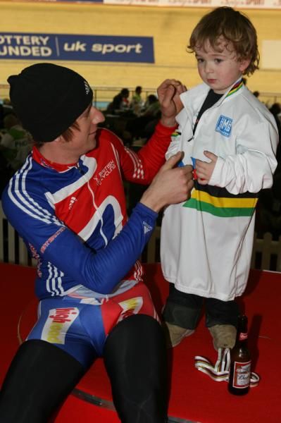 Bradley Wiggins gets his son to try on his new stripey jersey