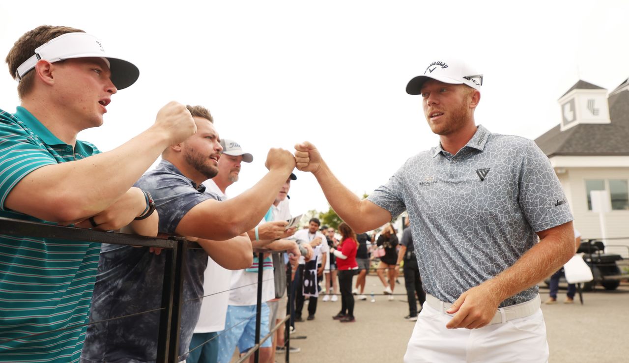 Gooch fist bumps some fans at the LIV Golf Series event