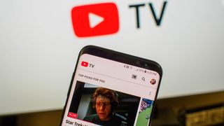 YouTube TV home page with TV screen in background