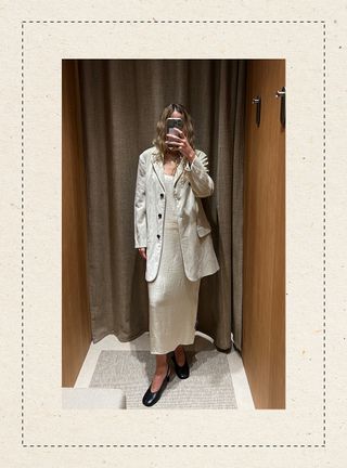 Eliza Huber in the dressing room at Massimo Dutti's new Miami store wearing a cream slip dress and a matching velvet jacket.