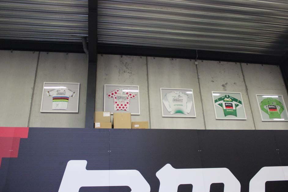 A row of jerseys won by various members of the team sits up high on the wall