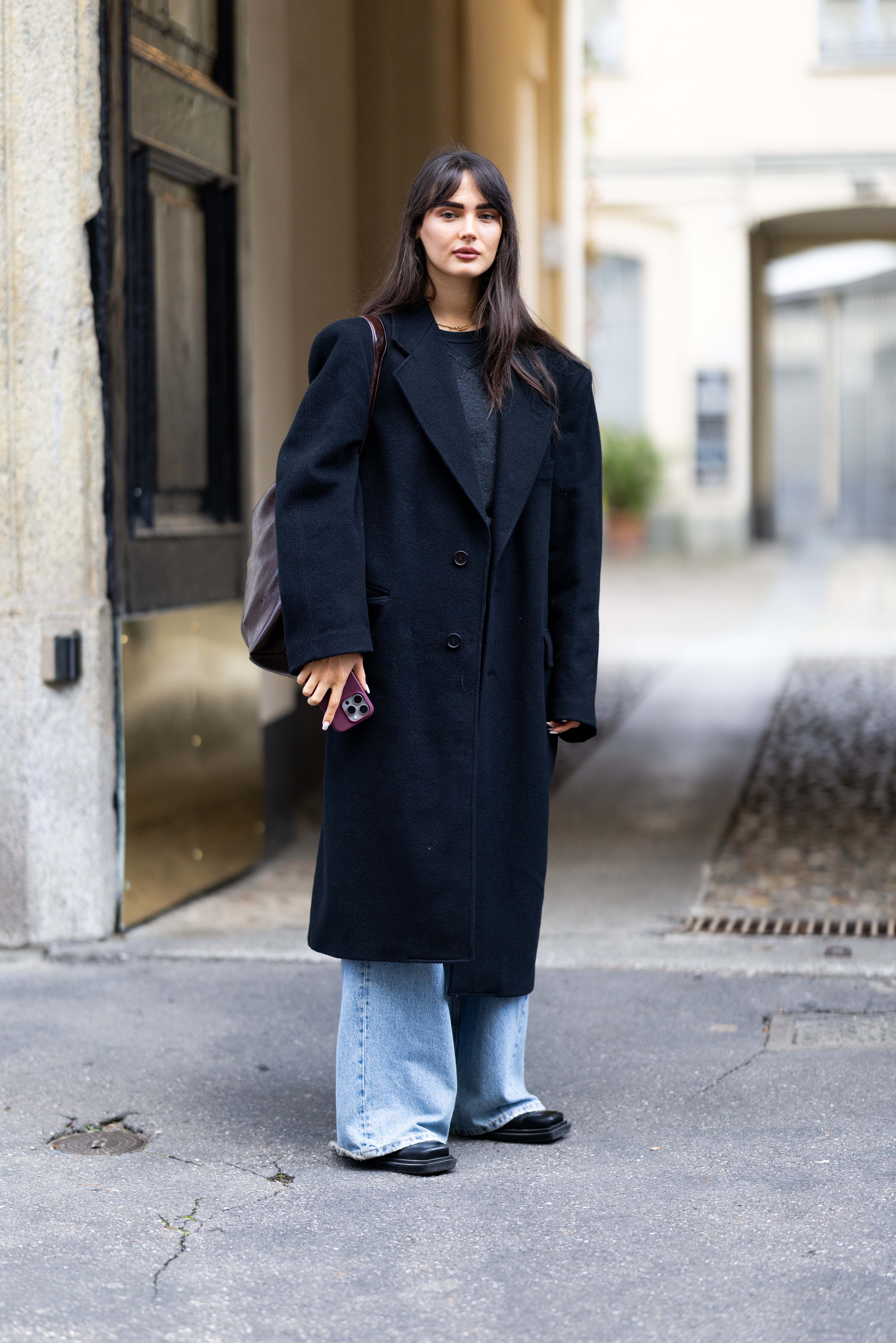 Woman wearing a light wash jeans outfit.