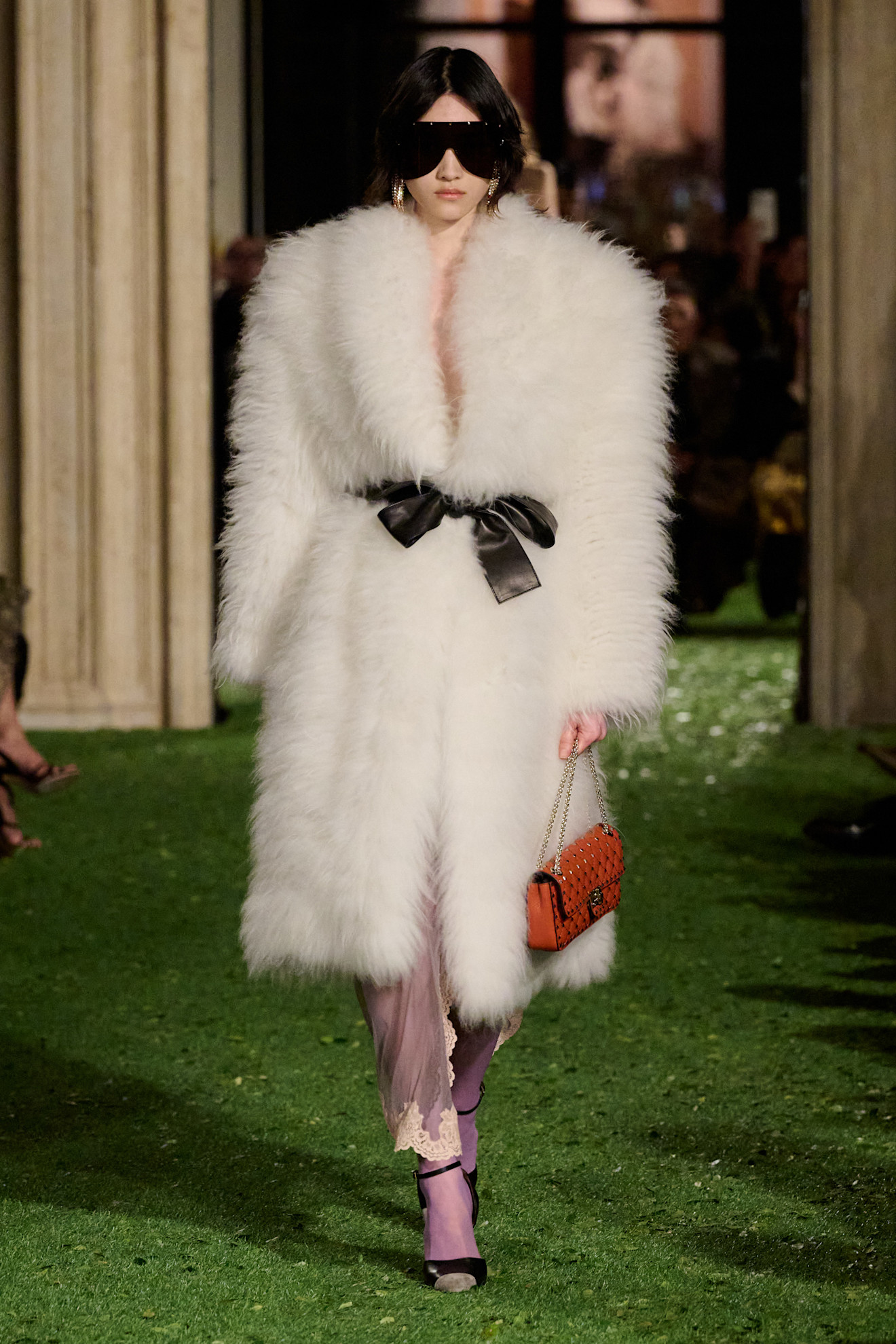 Photos of runway models at Valentino Fall Winter 2026 show.