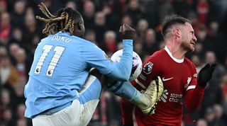 Liverpool midfielder Alexis Mac Allister is kicked by Manchester City's Jeremy Doku in a controversial incident late in the teams' Premier League clash at Anfield in March 2024.