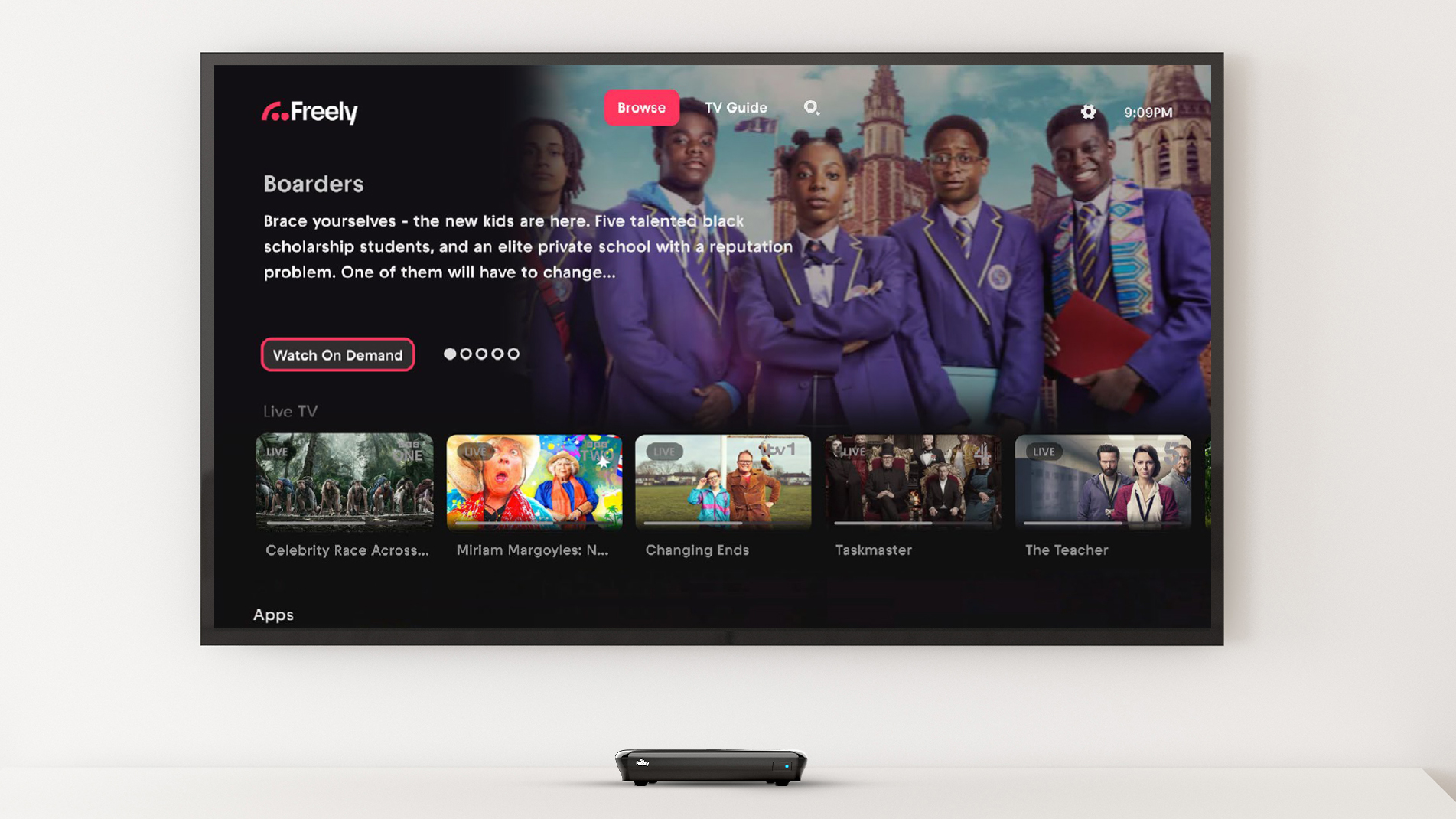 The Humax Aura EZ set-top box under a TV with the Freely interface on it